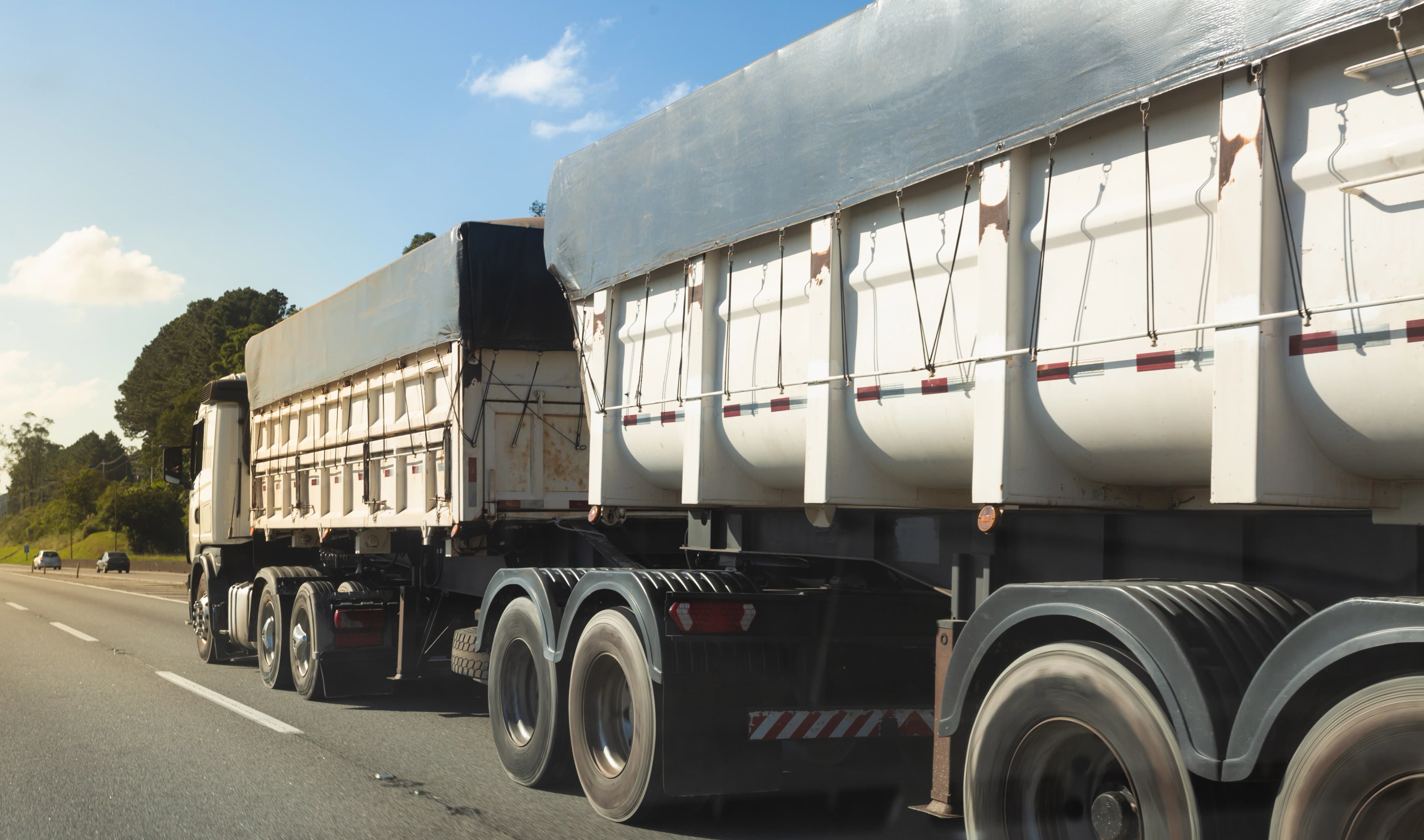 Semi-truck with multiple trailers on the highway